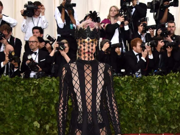 She opted for a bold sheer look at the 2018 Met Gala with a lace face covering and matching crown.