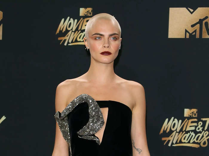 At the 2017 MTV Movie and TV Awards a week later, she wore a strapless black minidress with a silver ruffle at the neckline and a triangular cutout on the chest.