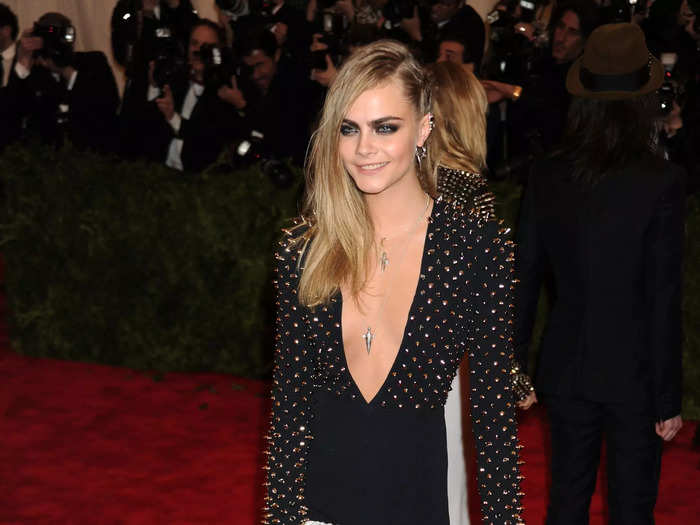 Delevingne attended the 2013 Met Gala wearing a studded black gown that was cut almost to her belly button.