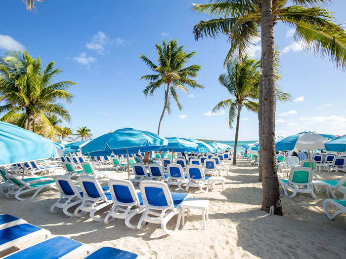 With rows of brightly colored lounge chairs and umbrellas, these two destinations looked nearly identical to hotel-owned beach clubs that cost a pretty penny to visit.