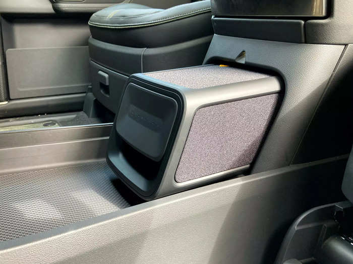 Likewise, Rivian includes a bluetooth speaker under the center console that owners can whip out during beach bonfires or camping trips.