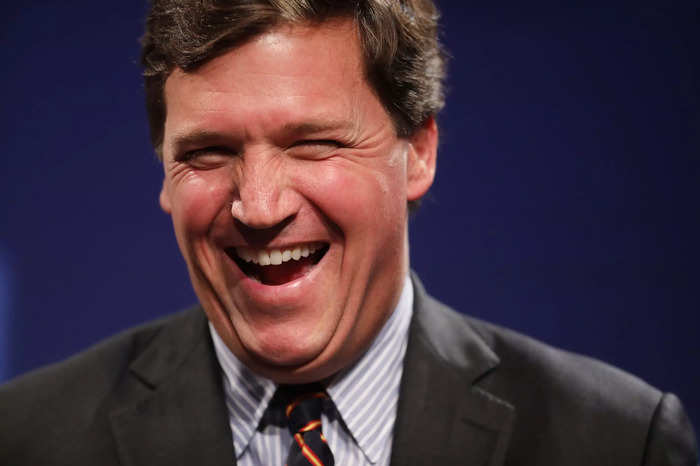 Fox News producer alleges Tucker Carlson's team plastered photos around ...