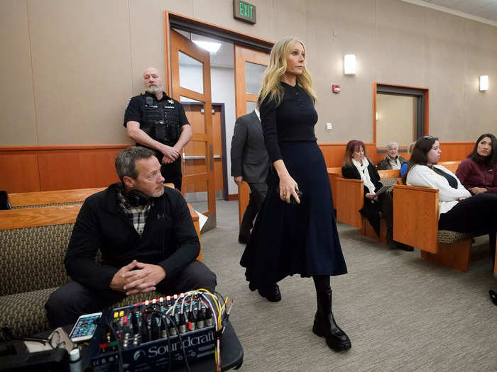 Day four in court saw Paltrow opt for an all-navy sweater and midi-skirt, paired with tights and chunky black boots.