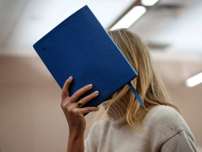 Paltrow used a pricey notebook to cover her face from courtroom cameras.