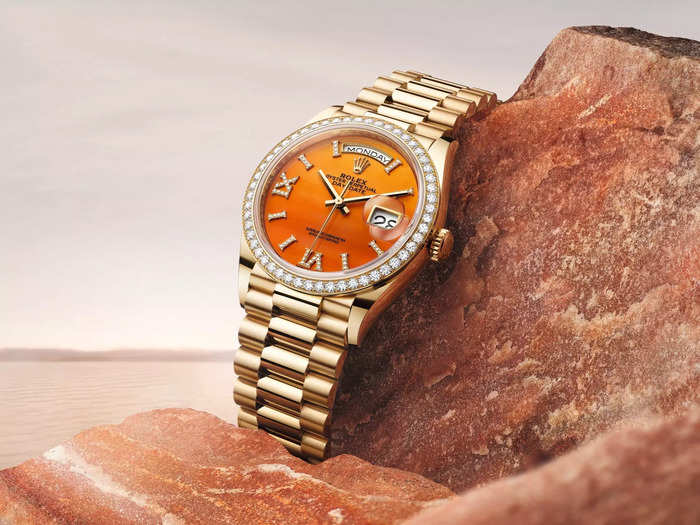 Another featuring an orange Carnelian stone dial.