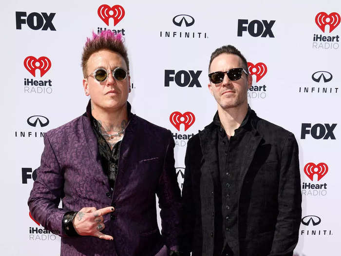 Two members of Papa Roach wore contrasting suits for the awards show.