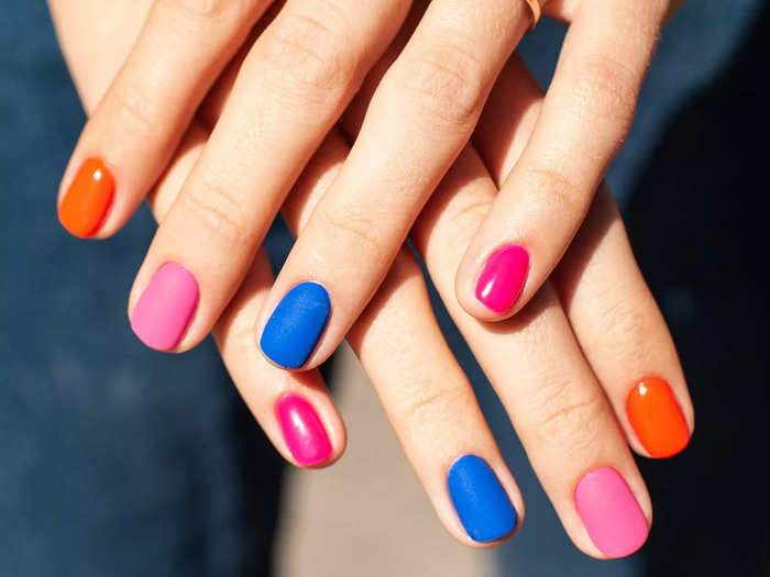 Rainbow nails are fun and playful.