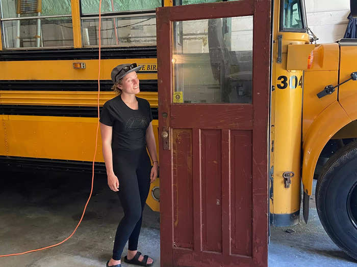 The couple bought a solid wood door off Facebook Marketplace. Nestoruk stripped the wood and sanded it, then Touserkani used a table saw to make adjustments to its height and width to fit on the bus.