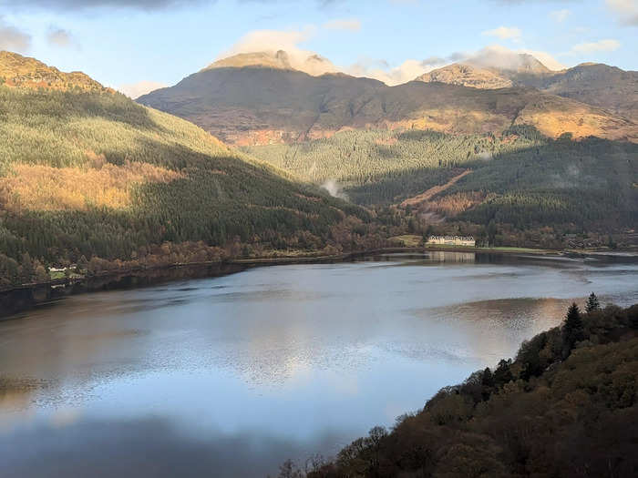 Waterfalls splashed down the mountains as the train slid past Loch Long.