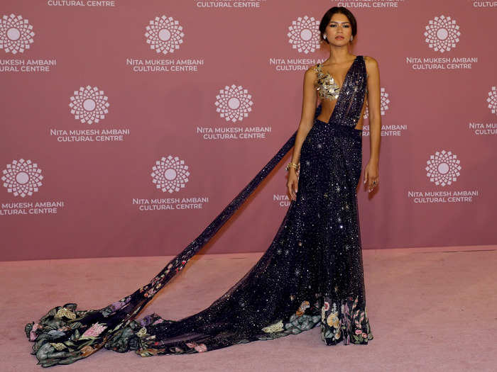 Zendaya wore a sheer violet sari embellished with star-themed designs that resembled a night sky.