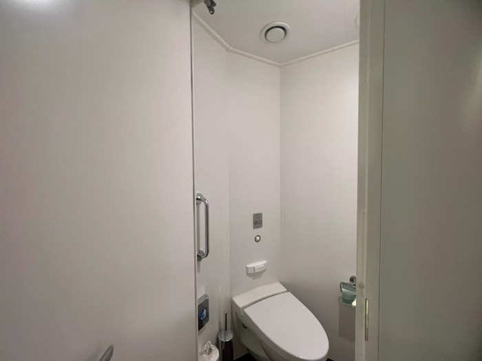 The toilet was enclosed in a separate room.