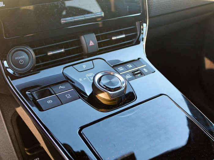 You switch into drive or reverse by pushing down and twisting an odd rotary dial.