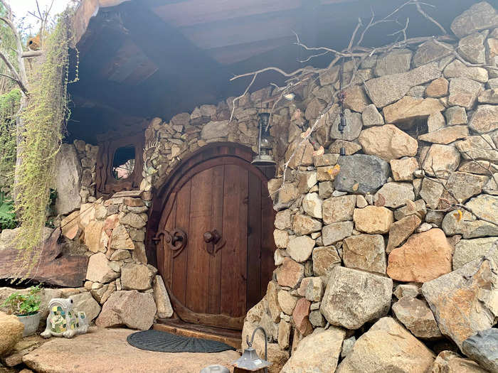 The exterior of the house was built out of stone and had the iconic round hobbit door I recognized from the movies.