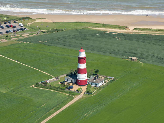 The red-and-white-striped Happisburgh Lighthouse, built in 1790, is the only independently run lighthouse in Great Britain.