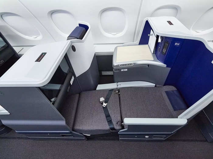 Like most other business class cabins, the seat comes with a flat screen TV, premium food, storage, and space to spread out.