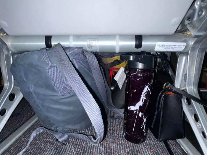 My backpack, purse, and water bottle fit beneath the seat in front of me, and left plenty of space to stretch my legs.