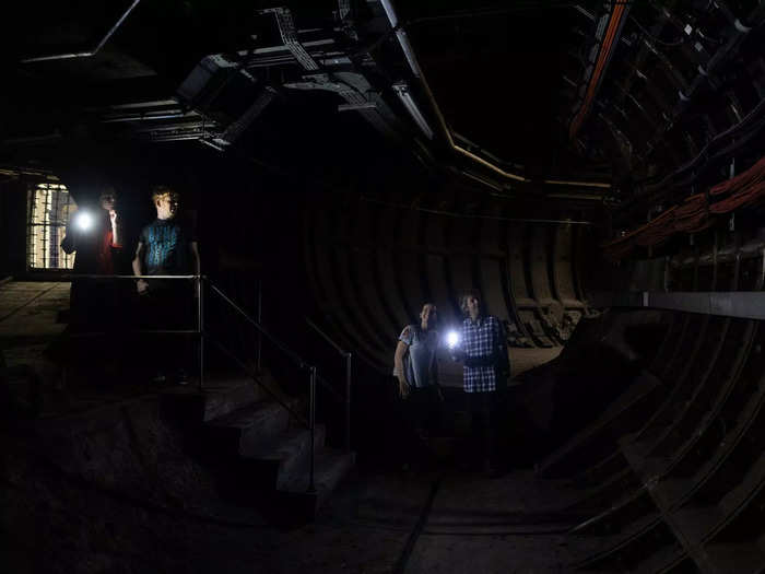 We learned about other historic features of underground travel — like the still-visible white glass tiling that was once used to reflect as much light as possible in the dim station. And that, in the early days of the tube, each train carriage had a guard that would call out the names of the stops for passengers.