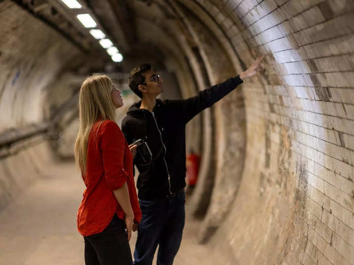 Standing at the top of the stairs, we learned about the history of the station, which opened in July 1900 as London