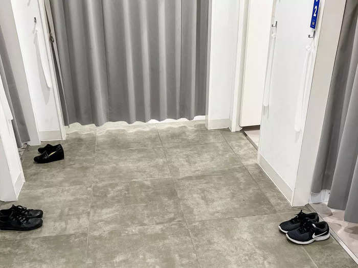 Customers remove their shoes before entering some dressing rooms to keep the spaces clean.