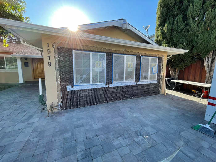 Möller installs concrete slabs — called stem walls — around the perimeter of the unit. To turn the garage door into a proper exterior wall, the stem wall has holes where the windows will go.