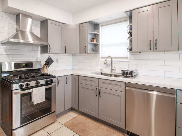 Cool-toned white and gray kitchens are falling out of favor.