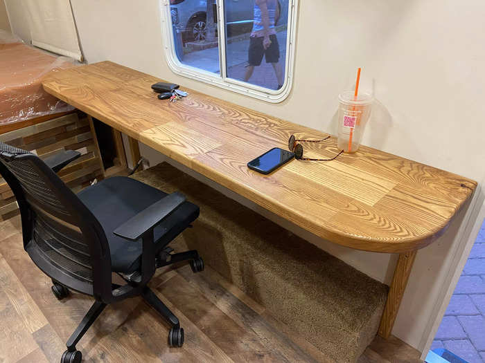 Most of the new furniture, such as their work desk and kitchen countertops, was built using wood pieces that they had accumulated from their shop.