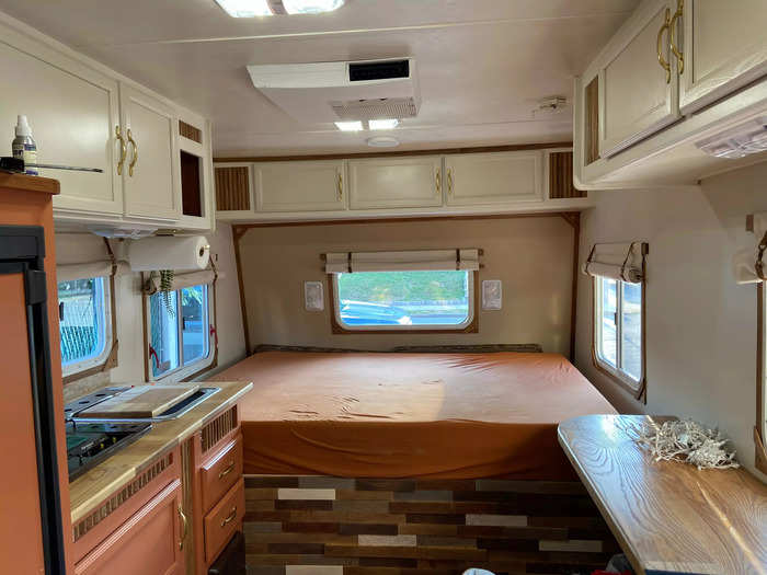 The couple rebuilt almost everything inside the trailer. The only things they kept were the cabinets, which they painted over.