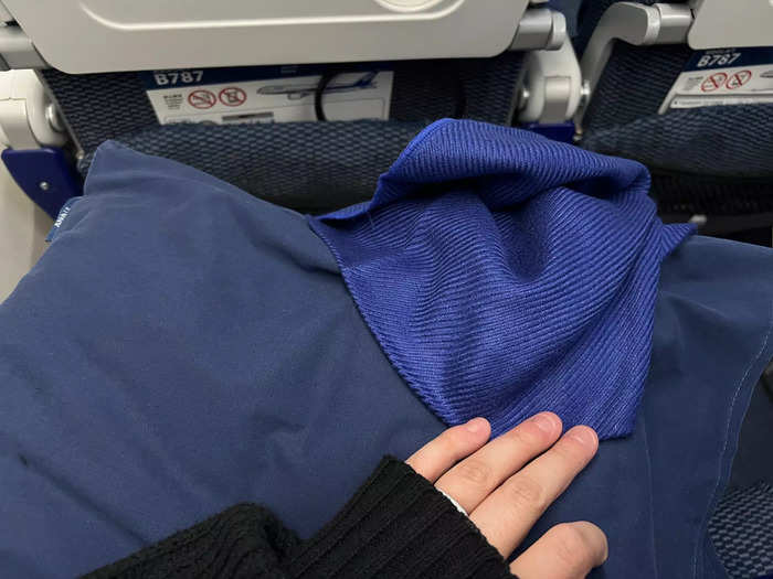 The added space and comfort — plus the pillow and silky blanket provided — made it much easier to sleep on the long-haul flight.