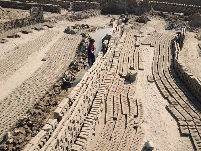 Workers stack the bricks in underground ovens where they bake for days, usually over a month. The kilns are estimated to reach nearly 2,000 degrees Fahrenheit.