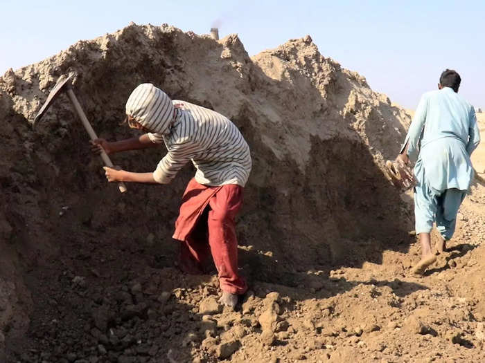 The process of making bricks is laborious and physically exhausting. First, one must accumulate enough dirt to mix with water.