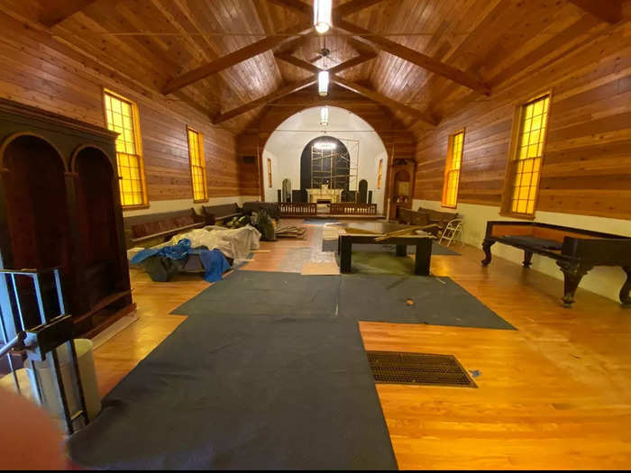 Rooney wanted to make as few adjustments to the raw space as possible. All of the wood in the chapel — which is now a living, dining, and game room — is original.