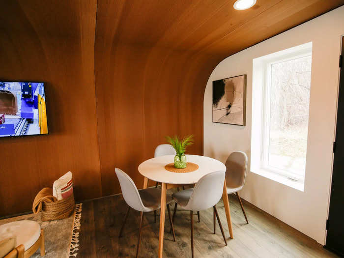 The dining table, TV, and leisure seating area were across from the kitchen and comfortably spaced apart from the rest of the room.