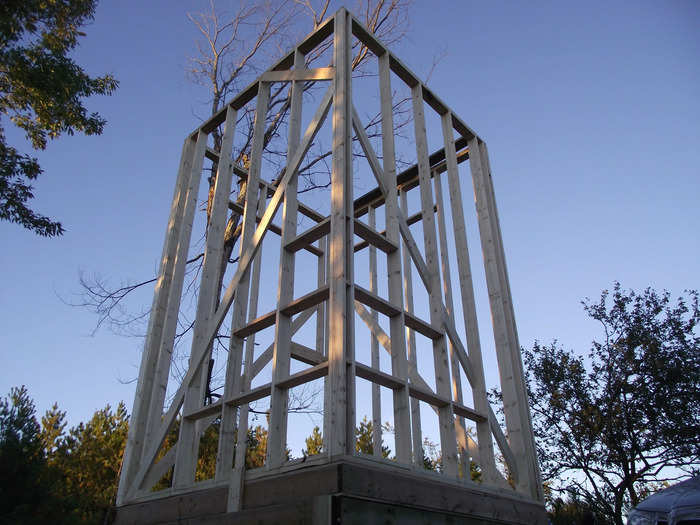 It took about a month for Russell and a friend to build the red tower. They first constructed a metal frame.