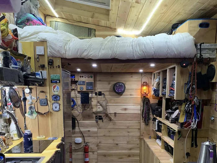 The box section of the truck is about 14 feet long. The loft and some storage cabinets are on one end, while the middle section is occupied by a kitchen countertop.