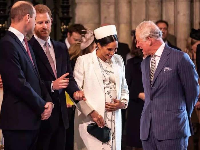 March 2019: Meghan cradled her baby bump as she spoke with Charles at a Commonwealth Day service at Westminster Abbey.