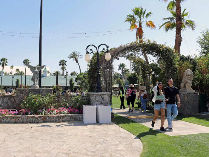 Deeper in the garden, a lounge awaits through the archways.