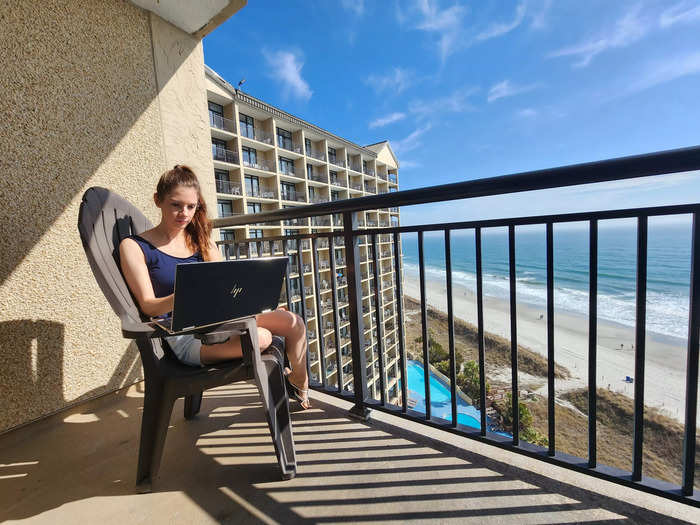 woman working on a balcony