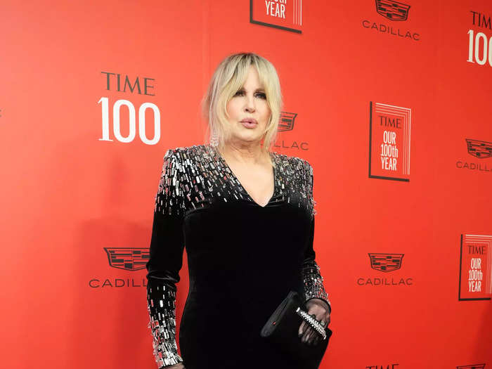 Jennifer Coolidge wore a floor-length black gown that was embroidered with gemstones on the train, shoulders, and sleeves.