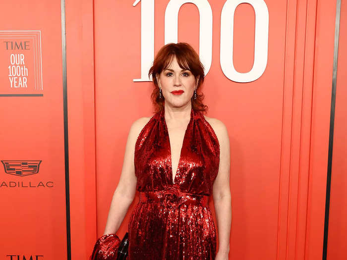 Molly Ringwald wore a floor-length, sequinned gown with a plunging neckline.