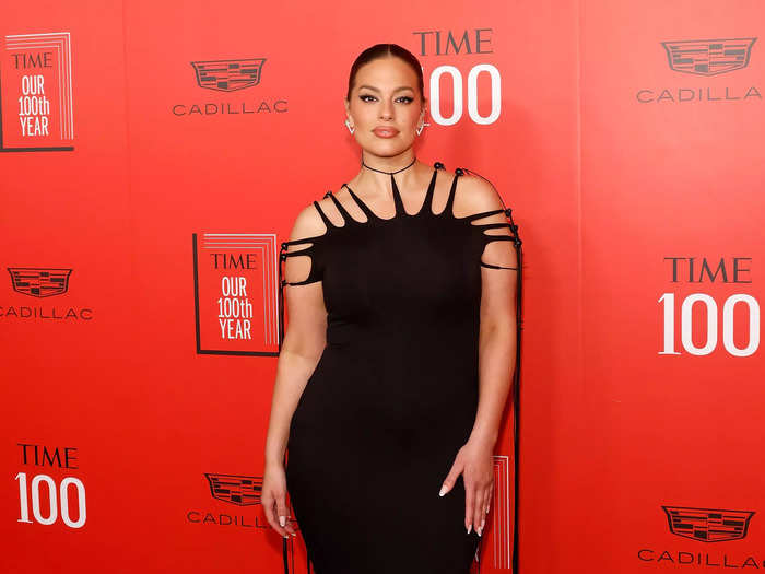 Ashley Graham opted for a black gown with a flowing train and spiked fringe straps that was styled by Emily Evans.
