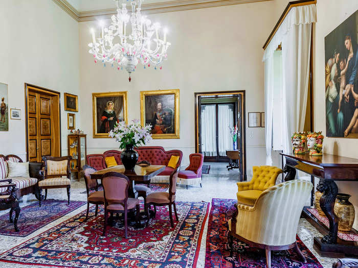 Throughout the house, many of the rooms are currently decorated with antique-looking furniture, ornate chandeliers, and artwork.