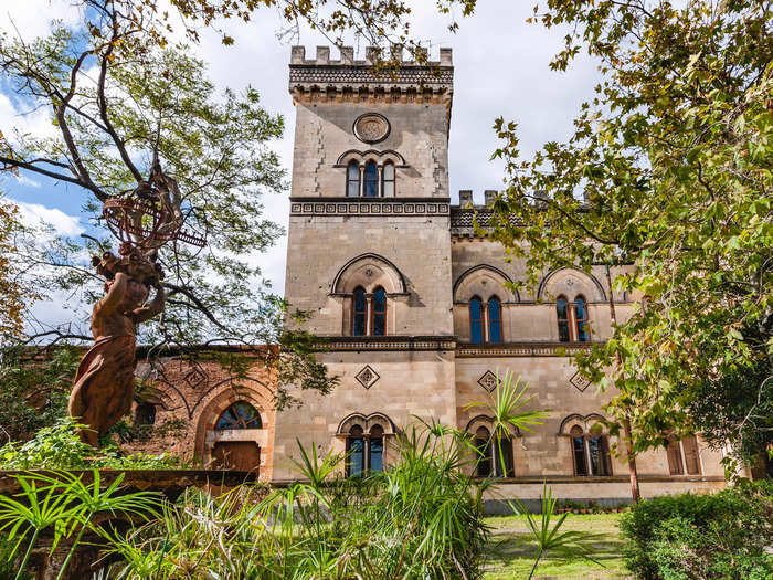 The 43,055-square-foot castle has neo-Gothic architecture and is framed by two towers.