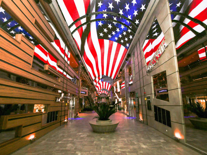 Up the crystal stairs, visitors will find an indoor promenade topped with a 262-foot-long LCD ceiling, shown below.