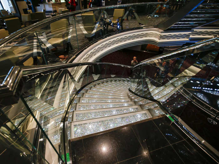 These striking stairs are a trademark of the cruise brand, a spokesperson said during the tour of the ship.