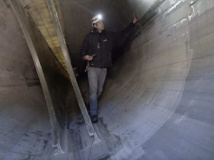 These blades are as long as a Boeing 747, or nearly the length of a soccer field. Sardo checks them from the inside before they go up on a turbine, because the blades are the hardest parts to repair when the turbine is finished.