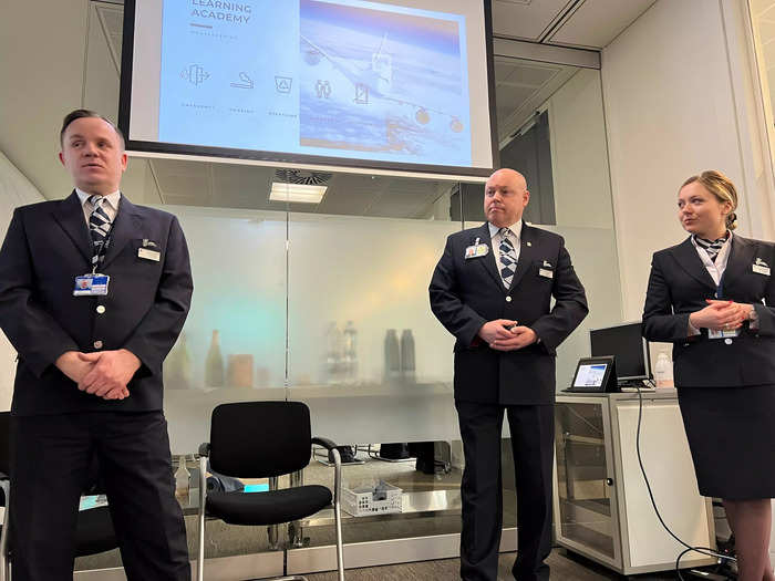 The day began with a presentation. Tim Baxter (center) said he wanted to be a flight attendant since the age of six, when he practiced serving Play-Doh food to family. He