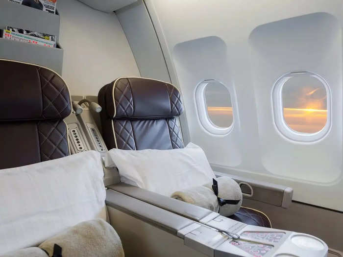 Both include the fancy hotels and meals, but Première comes with added perks, like "first class" service on the A340, extra excursions, and "grand luxury" accommodations.