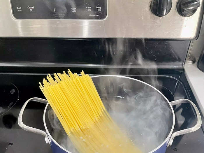 According to the recipe, cook the pasta in a large pot of salted boiling water until al dente. Drain and set aside.