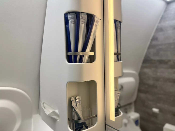 A few hours into the long-haul flight, I headed to the bathroom and loved to see toothbrushes, toothpaste, and mouthwash available.