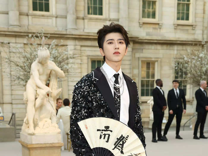 Chinese singer-songwriter Cai Xukun, better known as Kun, showed up in a sequinned Prada coat.